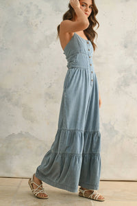 Denim jumpsuit featuring tiered bottom detail in chambray denim material