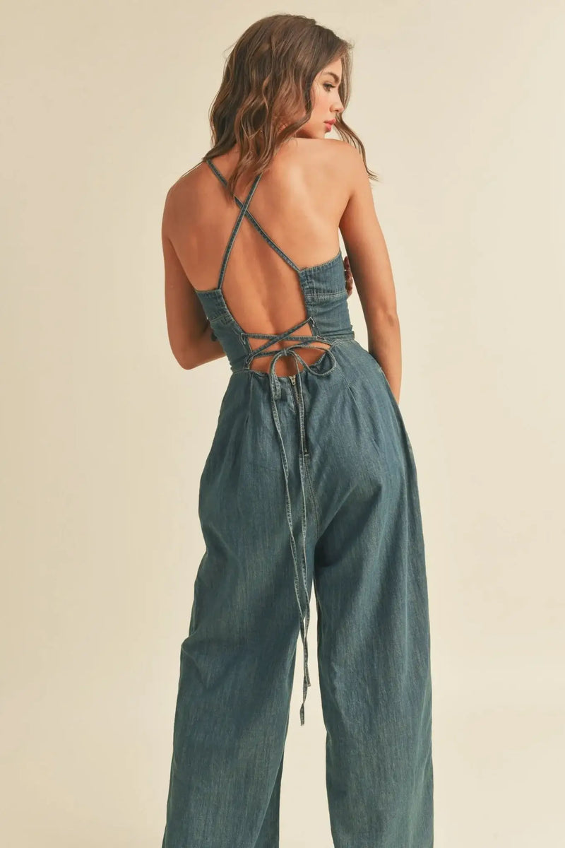 Washed denim jumpsuit with wide-leg design and crisscross back details