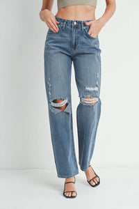 Distressed baggy skater jeans with ripped knees and a straight-leg cut