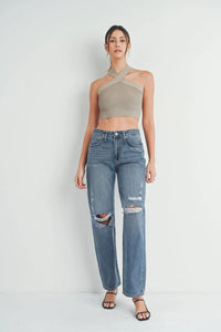 Distressed blue baggy skater jeans featuring stylish ripped knees for a trendy look