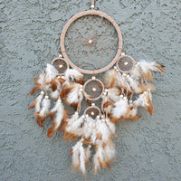 Small Dream Catcher elegantly displayed on a wall, capturing dreams and enhancing decor