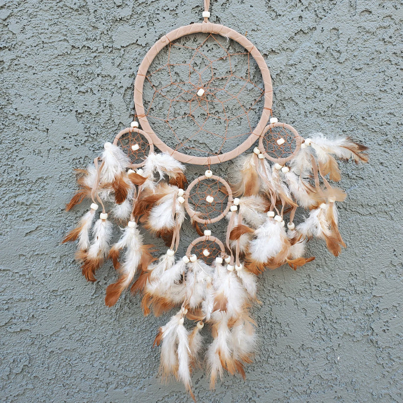 Small Dream Catcher elegantly displayed on a wall, capturing dreams and enhancing decor