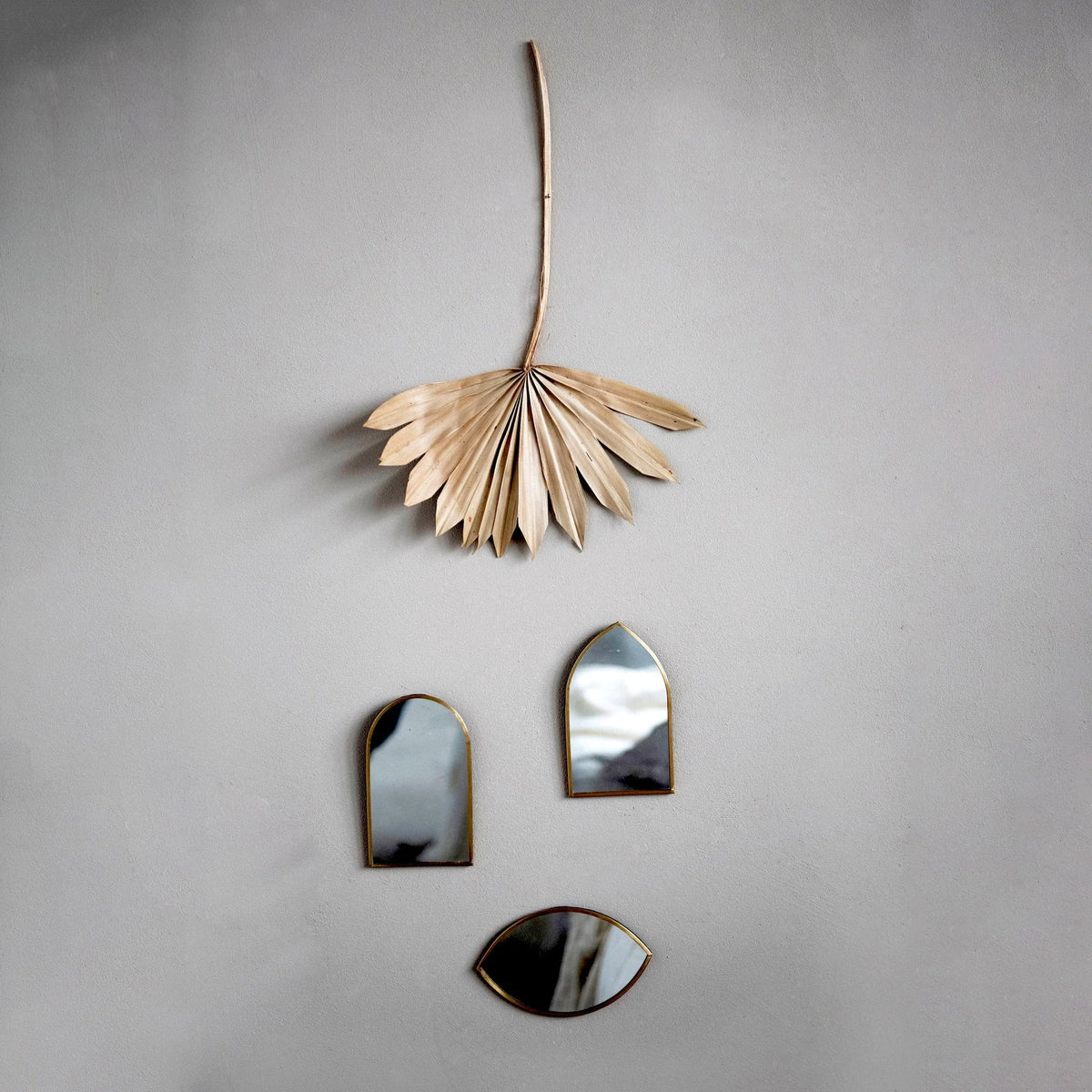 Dried Natural Buri Palm above decorative mirrors enhancing handcrafted lady finger display