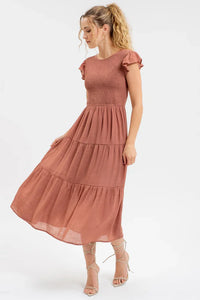 Dusty rose smocked tiered midi dress with flutter sleeves and fitted bodice