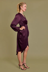 Elegant plum silk dress with long sleeves and side slits, perfect as a formal dinner dress