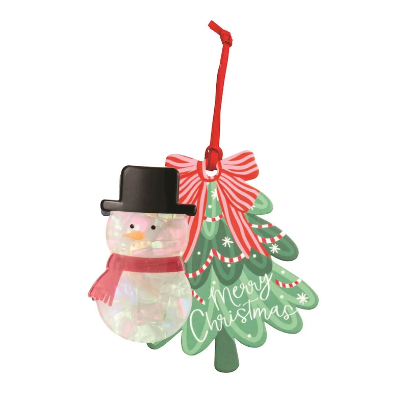 Festive Christmas ornament featuring a snowman and decorated tree on holiday gift hair clips