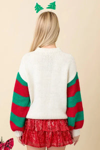 Holly Jolly Sweater featuring white body, striped sleeves, and Christmas tree headband