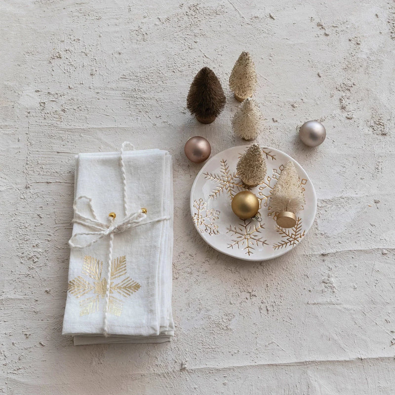 Festive table setting featuring a Stoneware Plate with gold electroplated snowflakes