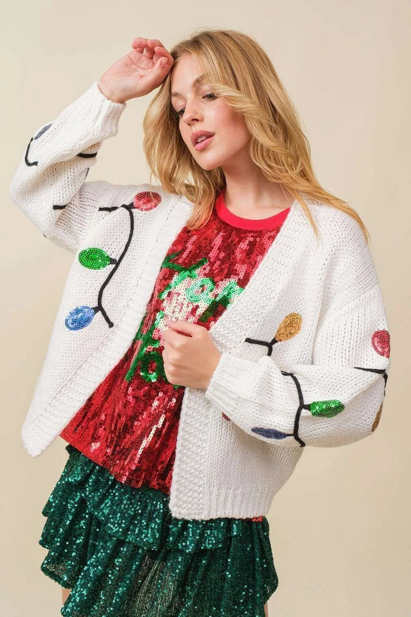 Festive white Christmas Sequin Light cardigan adorned with colorful Christmas lights