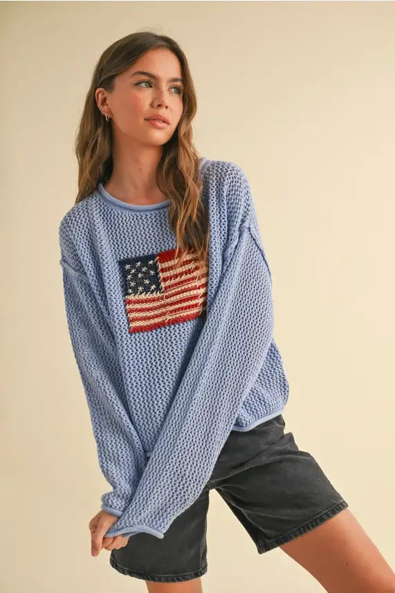 Blue knit sweater featuring American flag design from Shop Daisy, perfect for women’s boho chic clothing