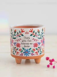 Floral-decorated ceramic planter from MINI ARTISAN PLANTER THANK YOU, perfect for women’s boho chic clothing displays