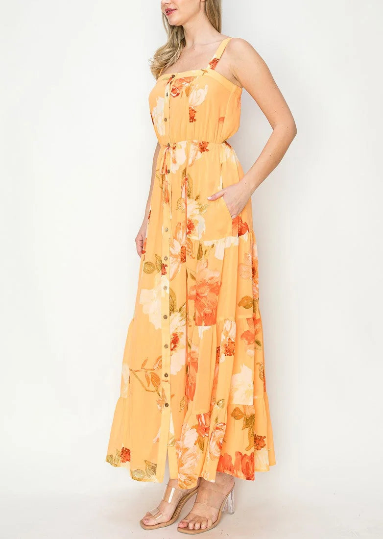 Floral print maxi dress in yellow with orange accents and spaghetti straps, boho style