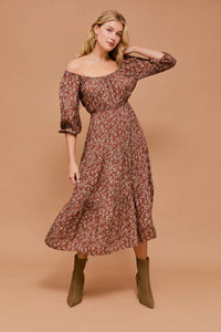 Floral print dress with three-quarter sleeves and open back for a stylish look