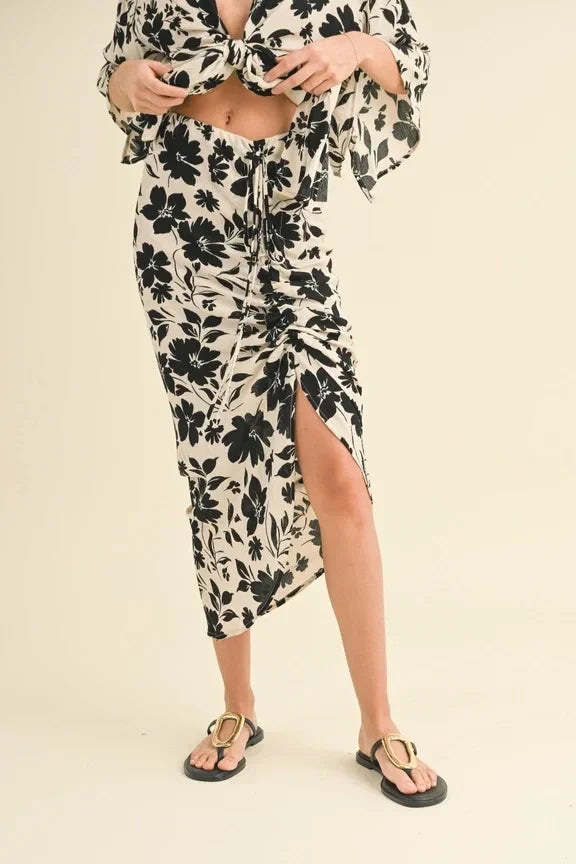 Floral print dress featuring a printed ruching skirt with side slit and ruched detailing