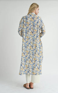 Blonde-haired person wearing a Floral HEIRLOOMS DUSTER DRESS viewed from behind