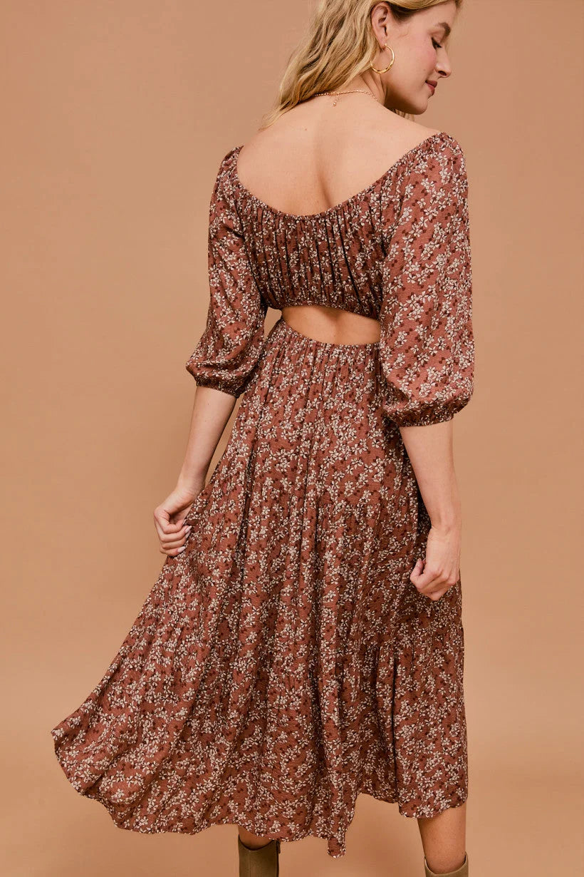 Floral print midi dress with puff sleeves and open back detail for stylish elegance