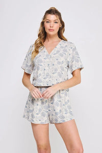 Seashell printed linen V neck romper with button-up design for a stylish look