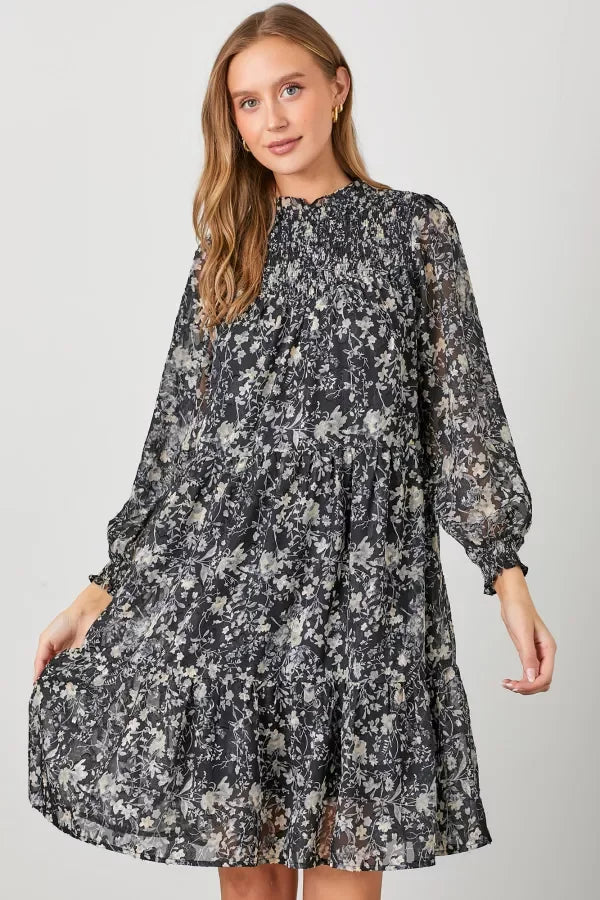 Floral print smocked yoke tiered dress with long sleeves and high neckline