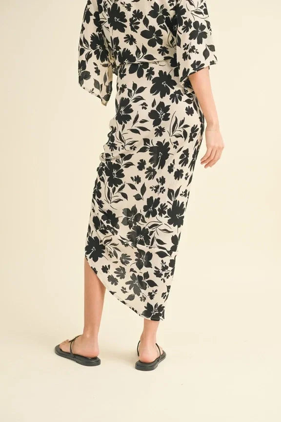 Floral print wrap dress with kimono sleeves and asymmetrical hem paired with printed ruching skirt