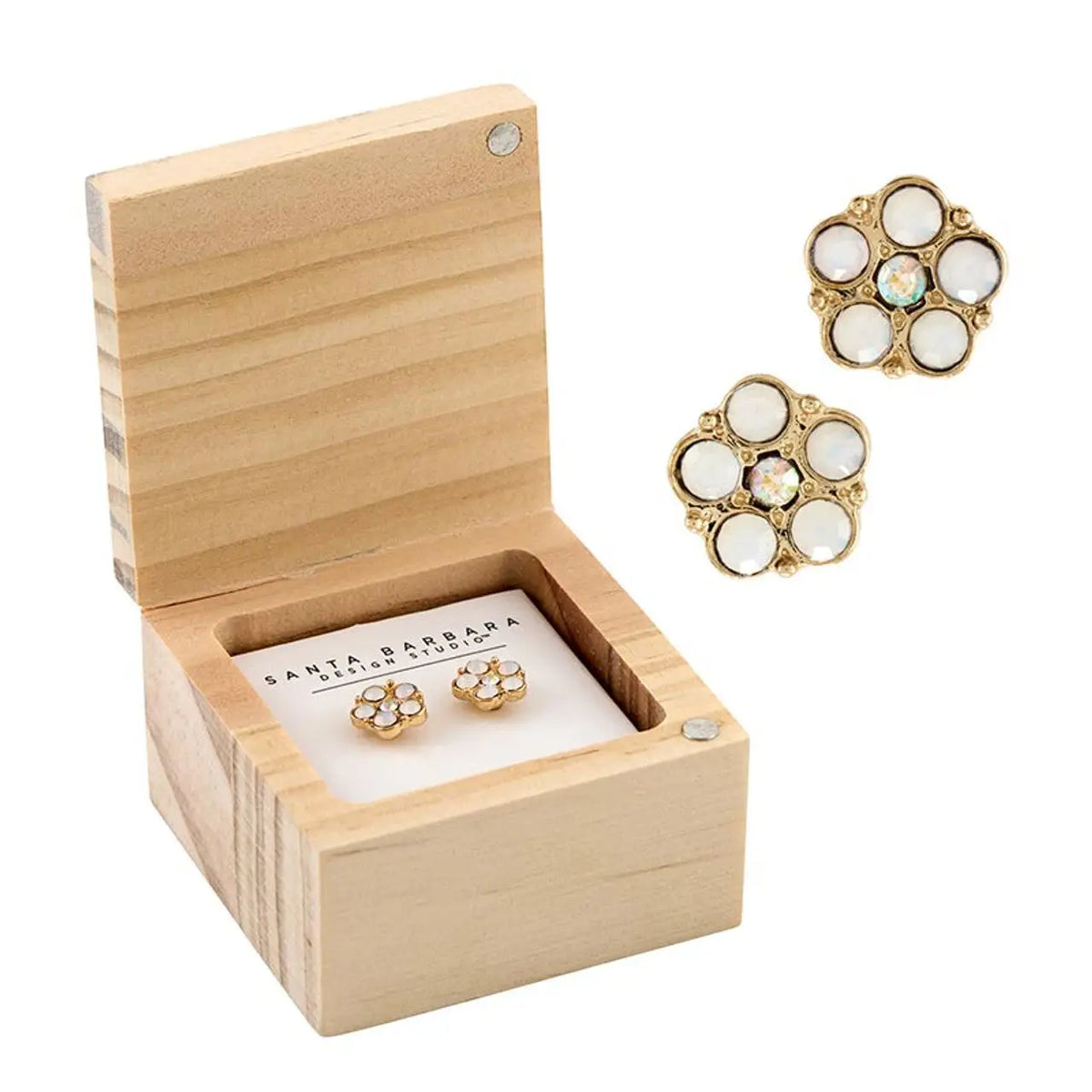 Crystal Daisy Earrings displayed in a wooden box, showcasing elegant flower-shaped daisy earrings