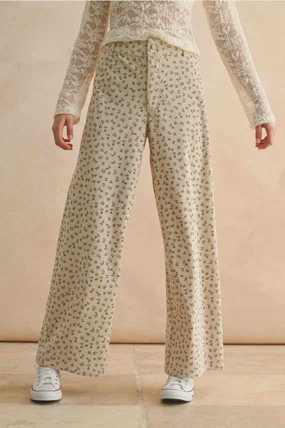 Flowy beige floral printed corduroy pants with wide-leg design for a stylish look