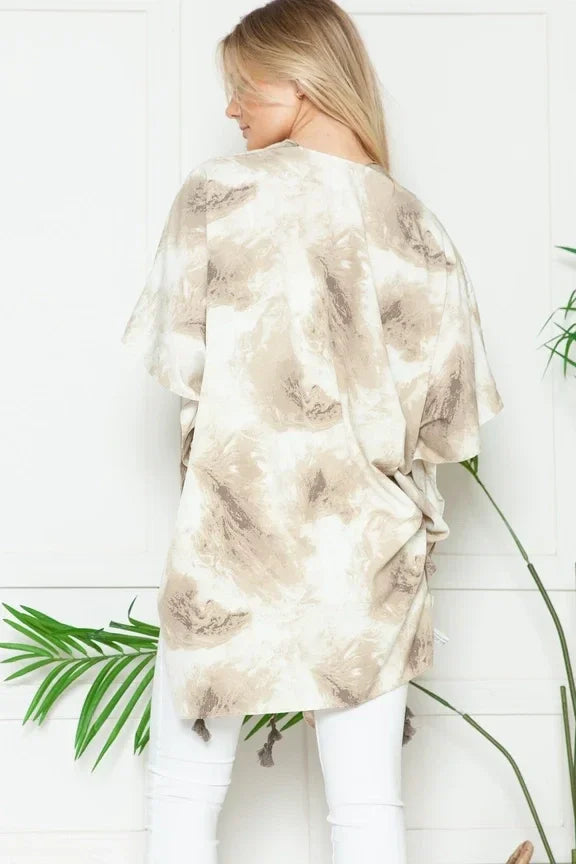 Fluffy beige and white Marble Print Kimono by Mellow Melanie worn by woman with blonde hair