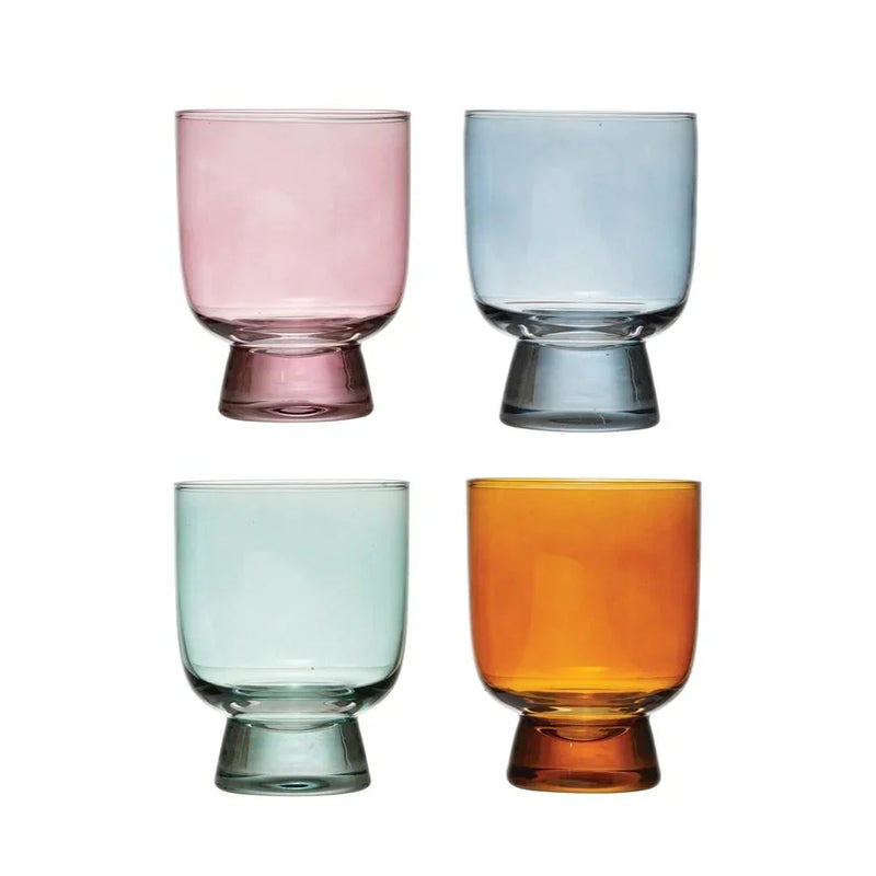 Four colored glass tumblers in pink, blue, green, and amber for Amber Drinking Glass