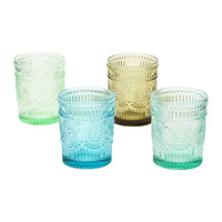Four colorful embossed drinking glasses with embossed patterns for stylish beverage serving