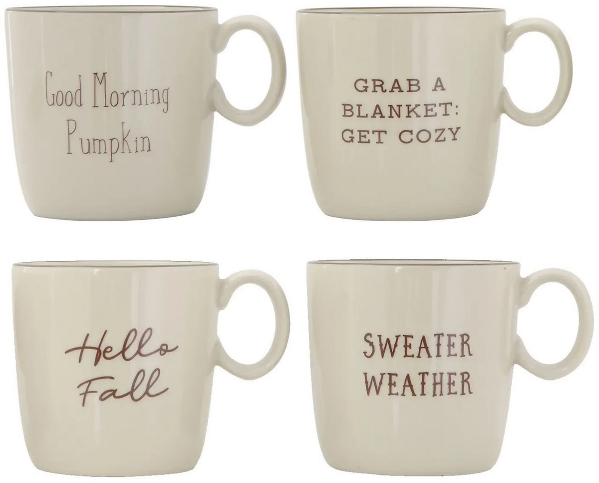 Four cream-colored ceramic mugs with autumn sayings from Shop Daisy for women’s boho chic clothing