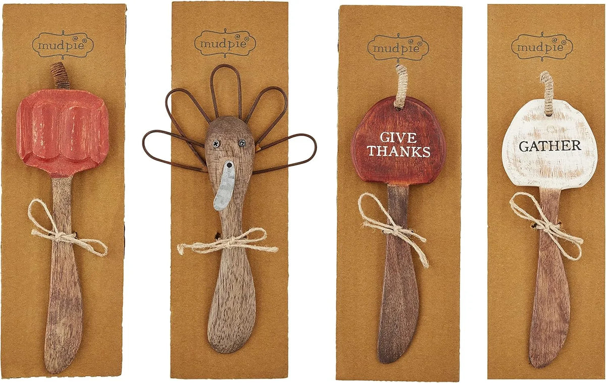 Four decorative wooden spoons with pumpkin ornaments, ideal for Thanksgiving butter spreader