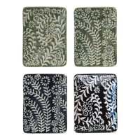 Four embossed floral ceramic tiles on a stoneware dish, ideal for women’s boho chic clothing shop Daisy