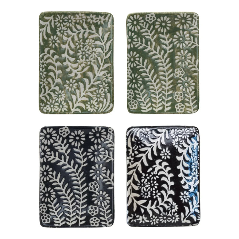 Four embossed floral ceramic tiles on a stoneware dish, ideal for women’s boho chic clothing shop Daisy