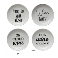 Four white stoneware dishes with wine sayings displayed from Shop Daisy suitable for women’s boho chic clothing advocators