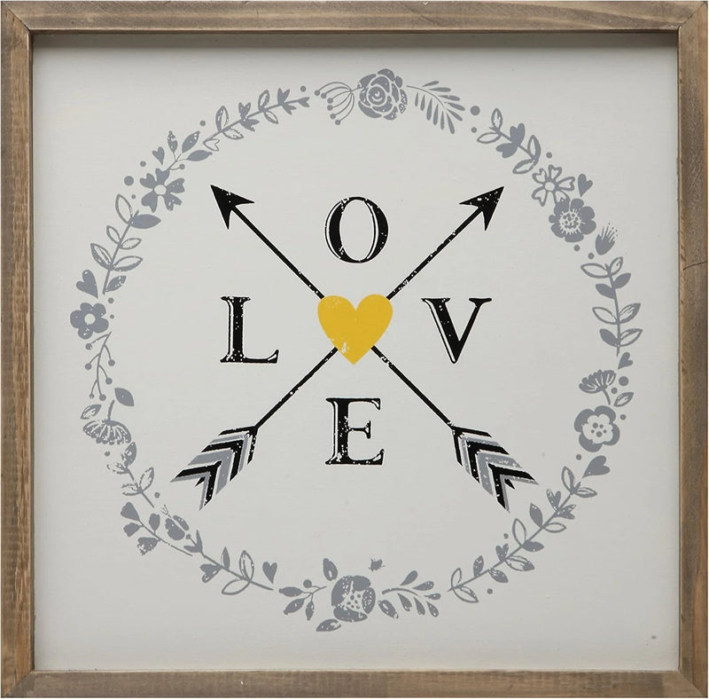 Framed LOVE artwork with arrows and heart, perfect for women’s boho chic clothing decor