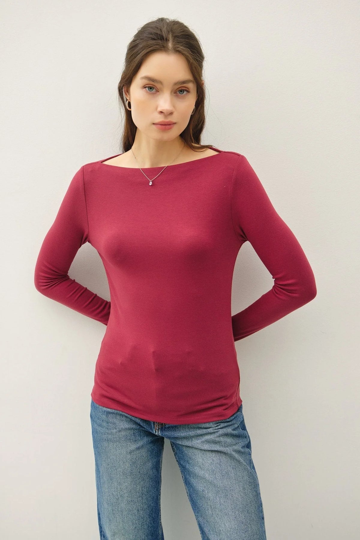 Fuchsia long-sleeve knit top with basic boat neck and fitted silhouette for women