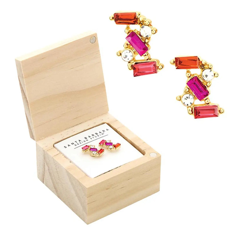 Elegant gemstone treasure box earrings in hot pink displayed with a wooden box