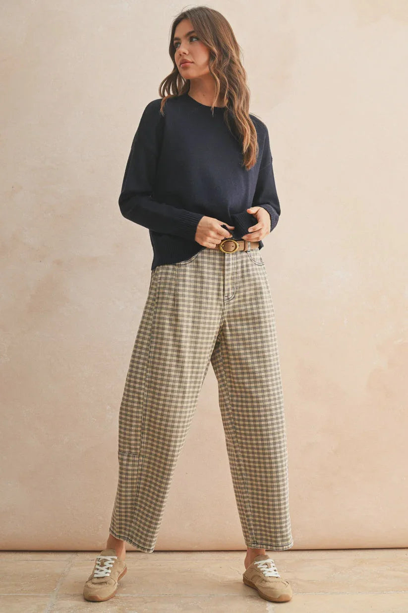 Mini checker pattern barrel pants with navy sweatshirt and beige sneakers
