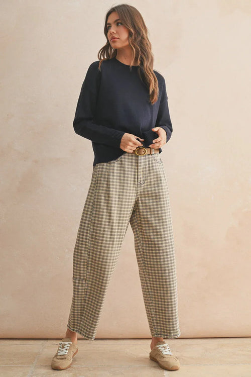 Mini checker pattern barrel pants with navy sweatshirt and beige sneakers