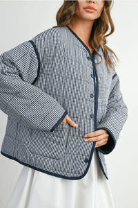 Buttoned quilted puffer jacket in gingham with navy trim and black buttons