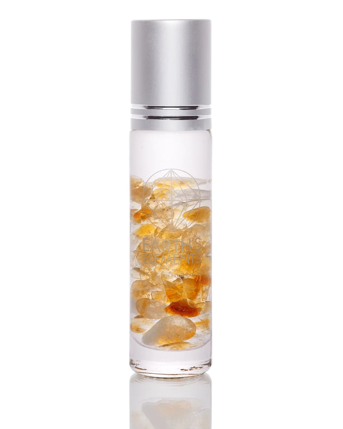 Glass bottle with yellow and orange crystals in liquid for organic essential oils gift