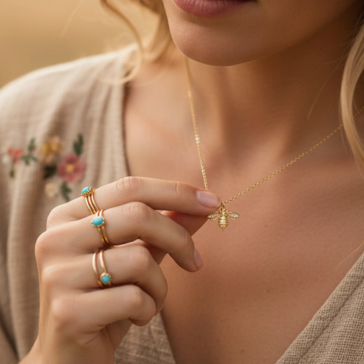 Gold bee zirconia necklace with turquoise accents and delicate chain for elegant jewelry