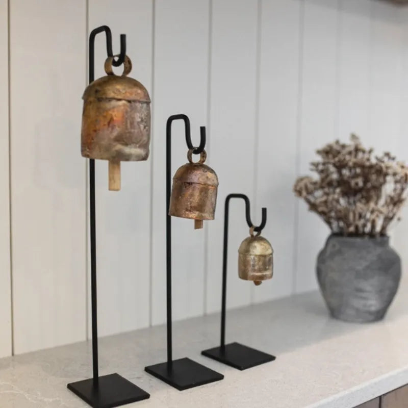 Vintage inspired iron bell stand with gold bell on black base