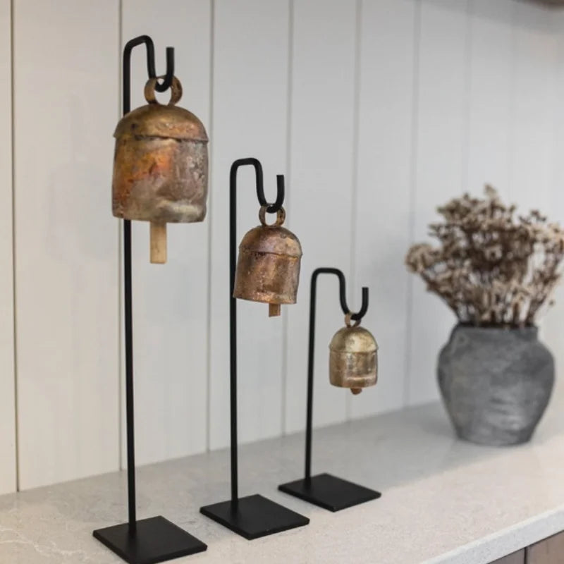 Vintage inspired iron bell stand with gold bell on black base