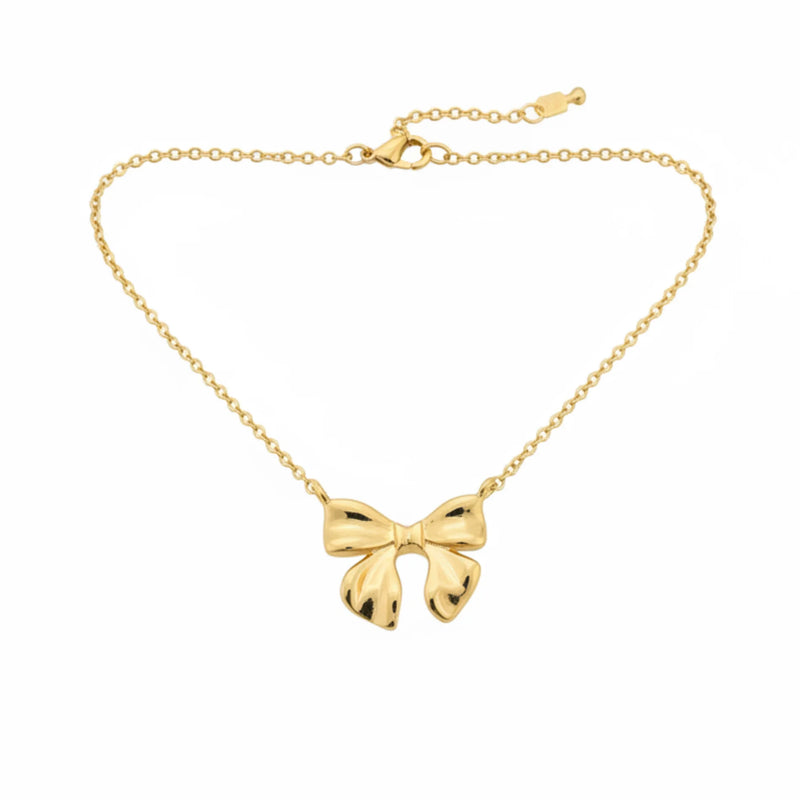 Dainty gold dipped bow necklace with polished finish and delicate chain for elegant style