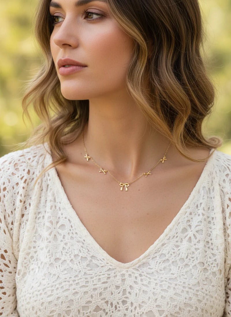 Gold bow free spirit necklace with star pendants from the GOLD BOW FREE SPIRIT NECKLACE collection