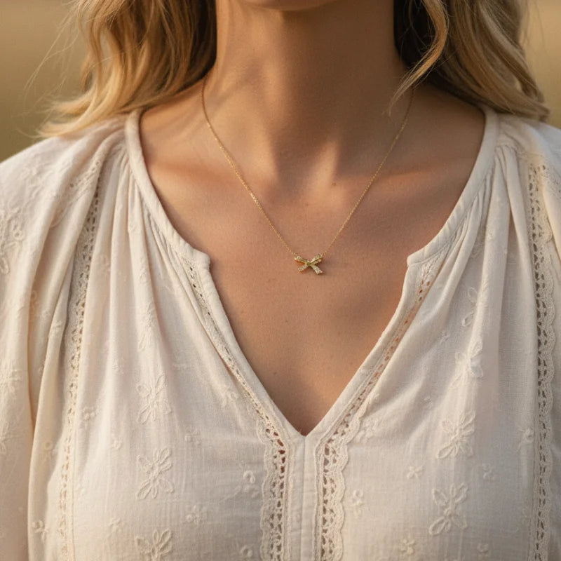 Free Spirit bow charm necklace with gold intricate design