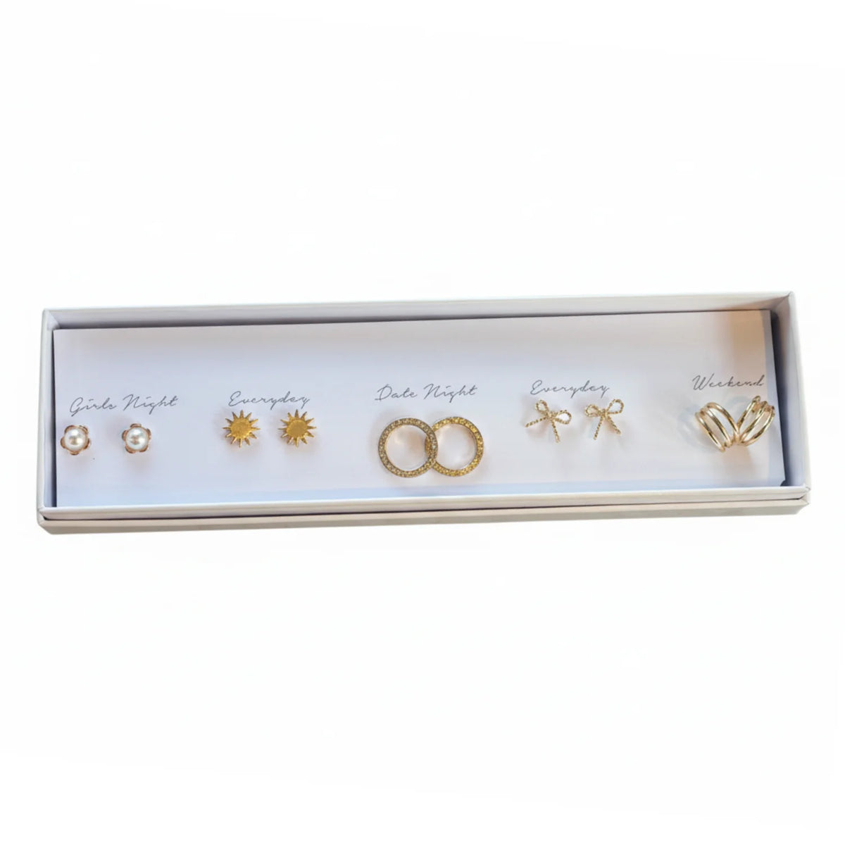 Free Spirit Gold earring journey with pearl-accented bow ring in white box