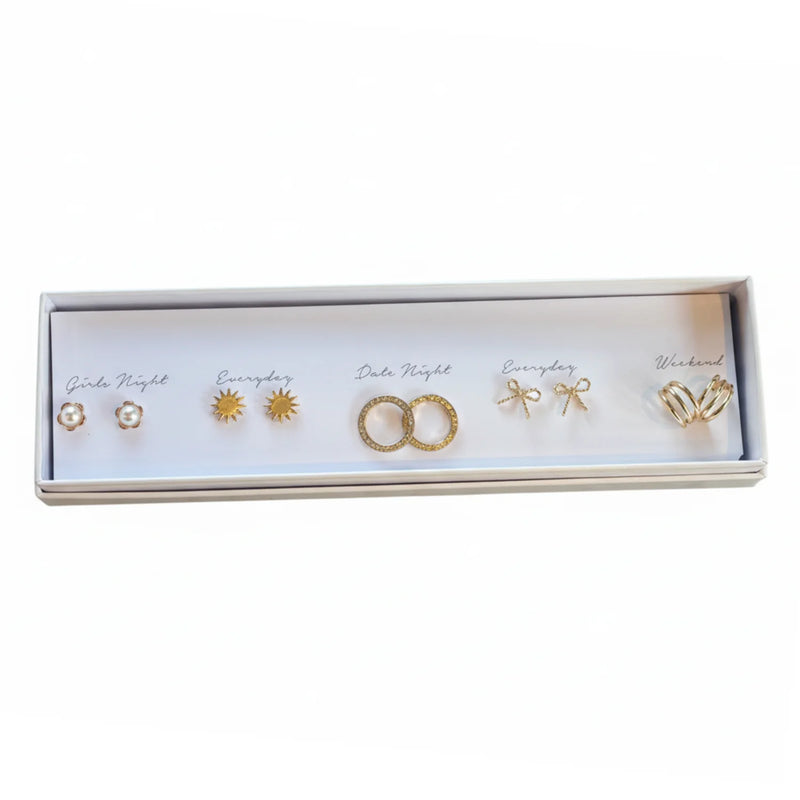 Free Spirit Gold earring journey with pearl-accented bow ring in white box