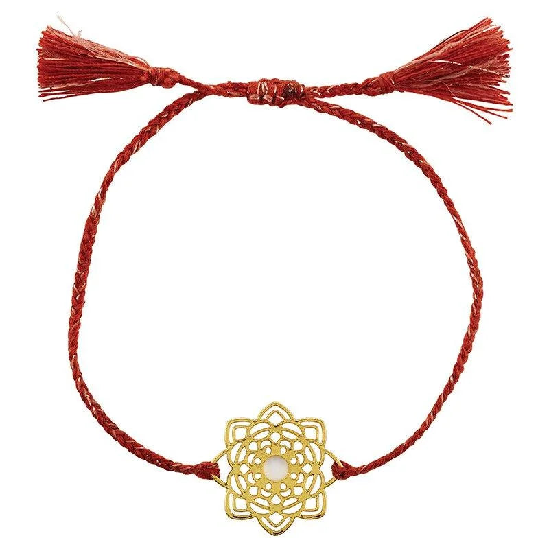 Gold bracelet with flower charm from the Spice Mandala collection