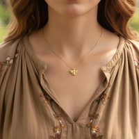 Gold butterfly necklace with intricate detailing and delicate chain, perfect for the Golden Bumblebee Spirit collection
